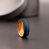 Modern men’s engagement ring with carbon fiber and turquoise