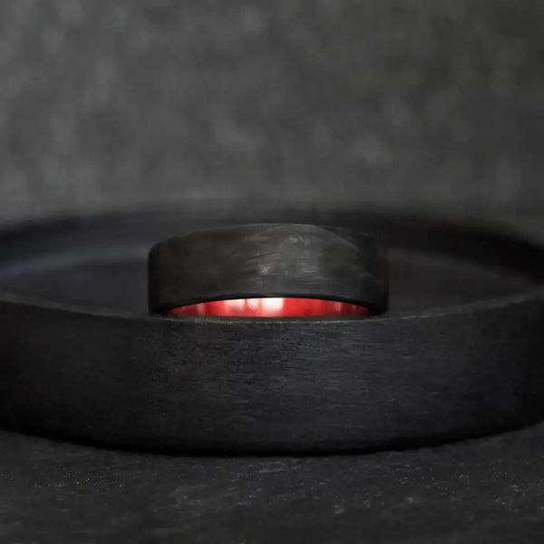 Forged Carbon Fiber and Redheart Wood Wedding Ring.