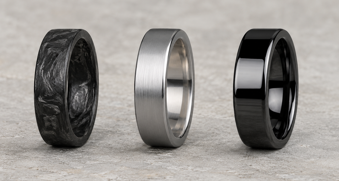 Carbon fiber, titanium and black ceramic men's wedding bands side by side