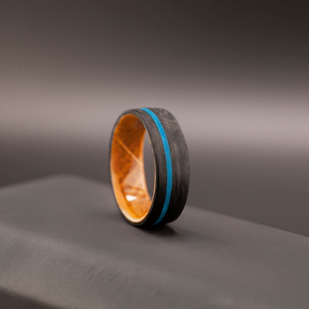 Carbon fiber ring with blue turquoise and whiskey barrel wood