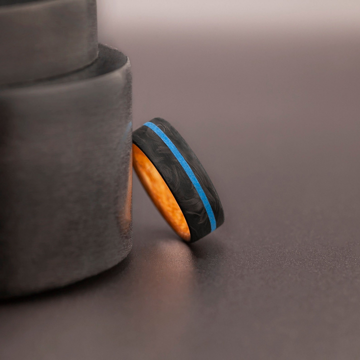 Anniversary ring for him made of carbon fiber and wood