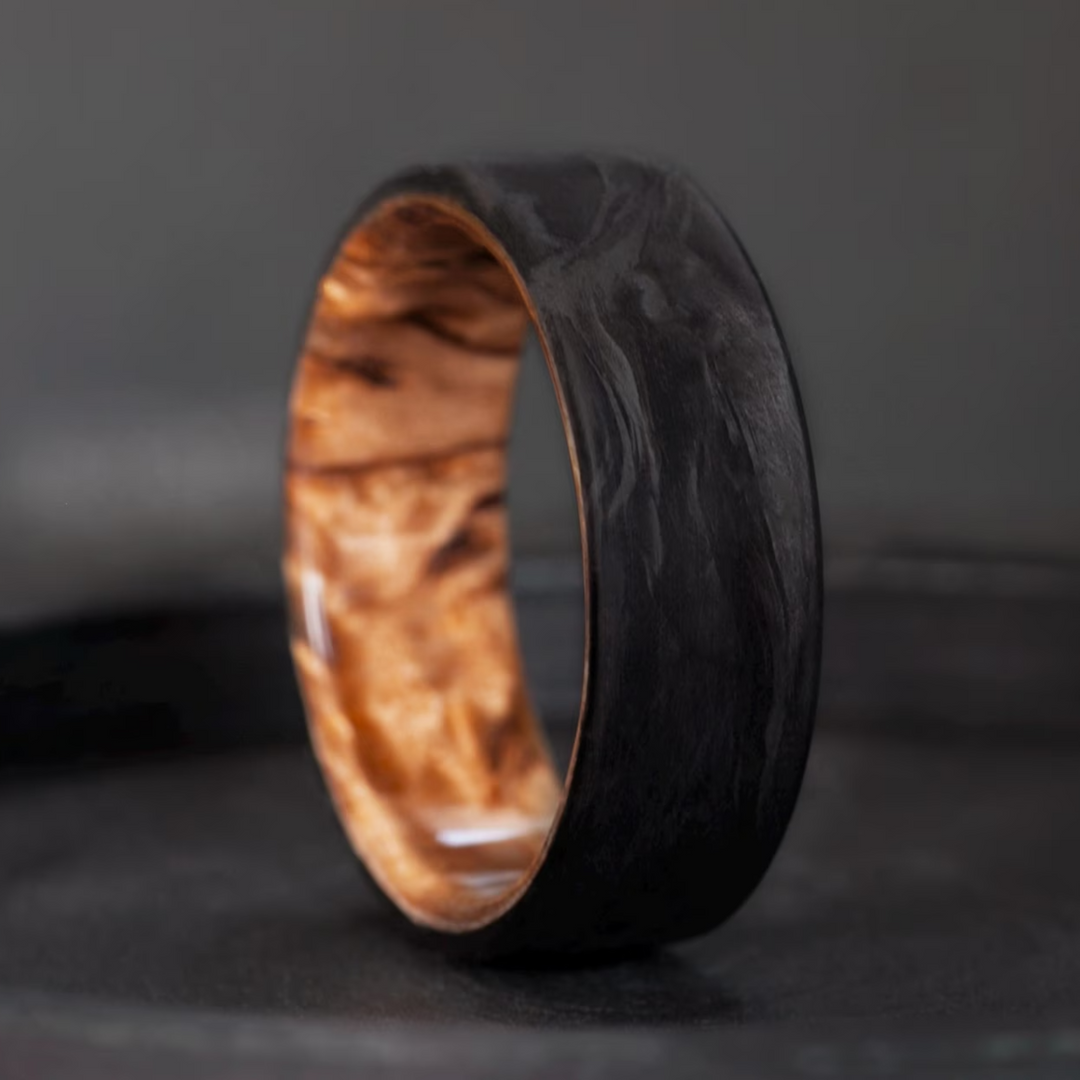 Karelian birch wood and forged carbon fiber ring.