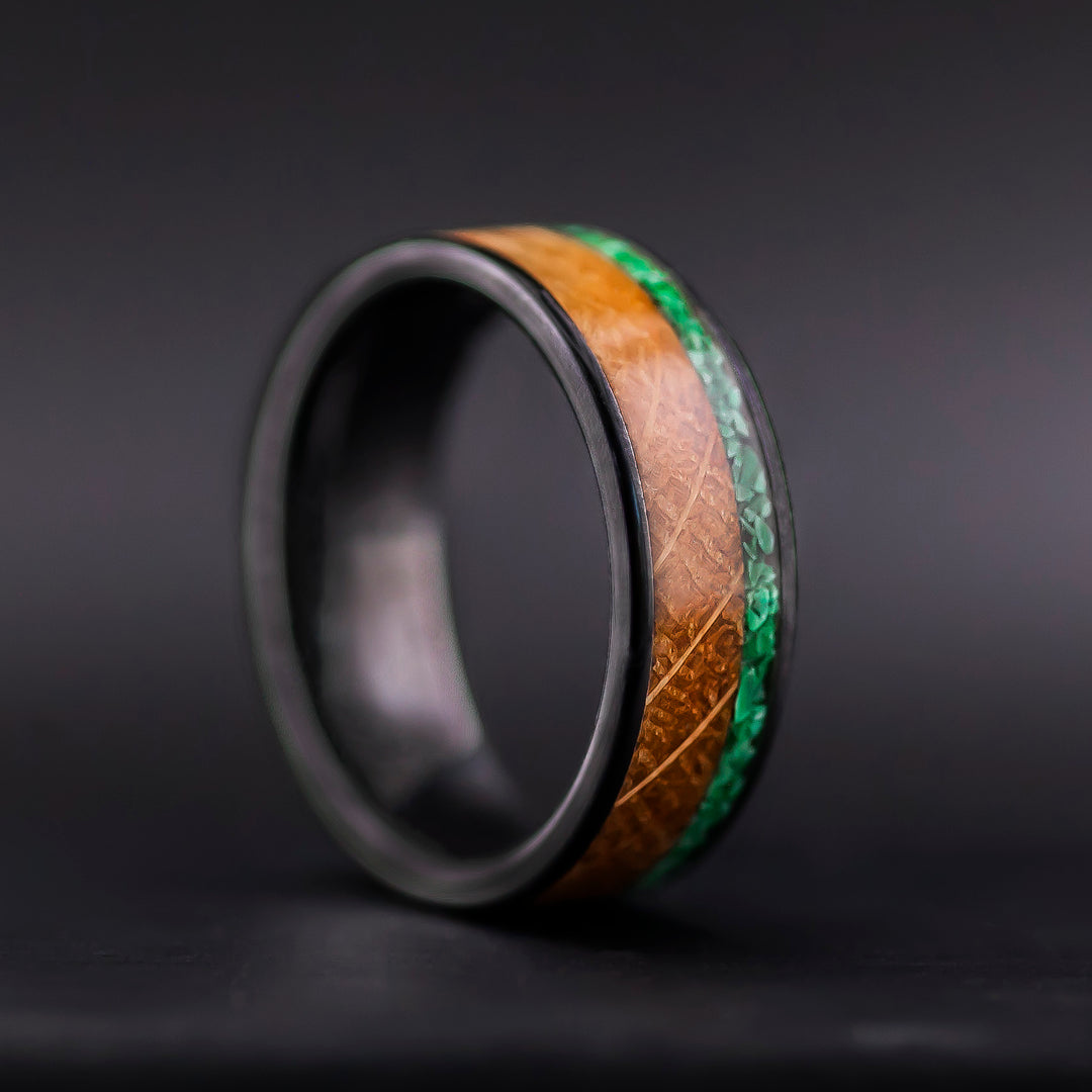 Alternative wedding band in black ceramic with bourbon oak and green malachite detail