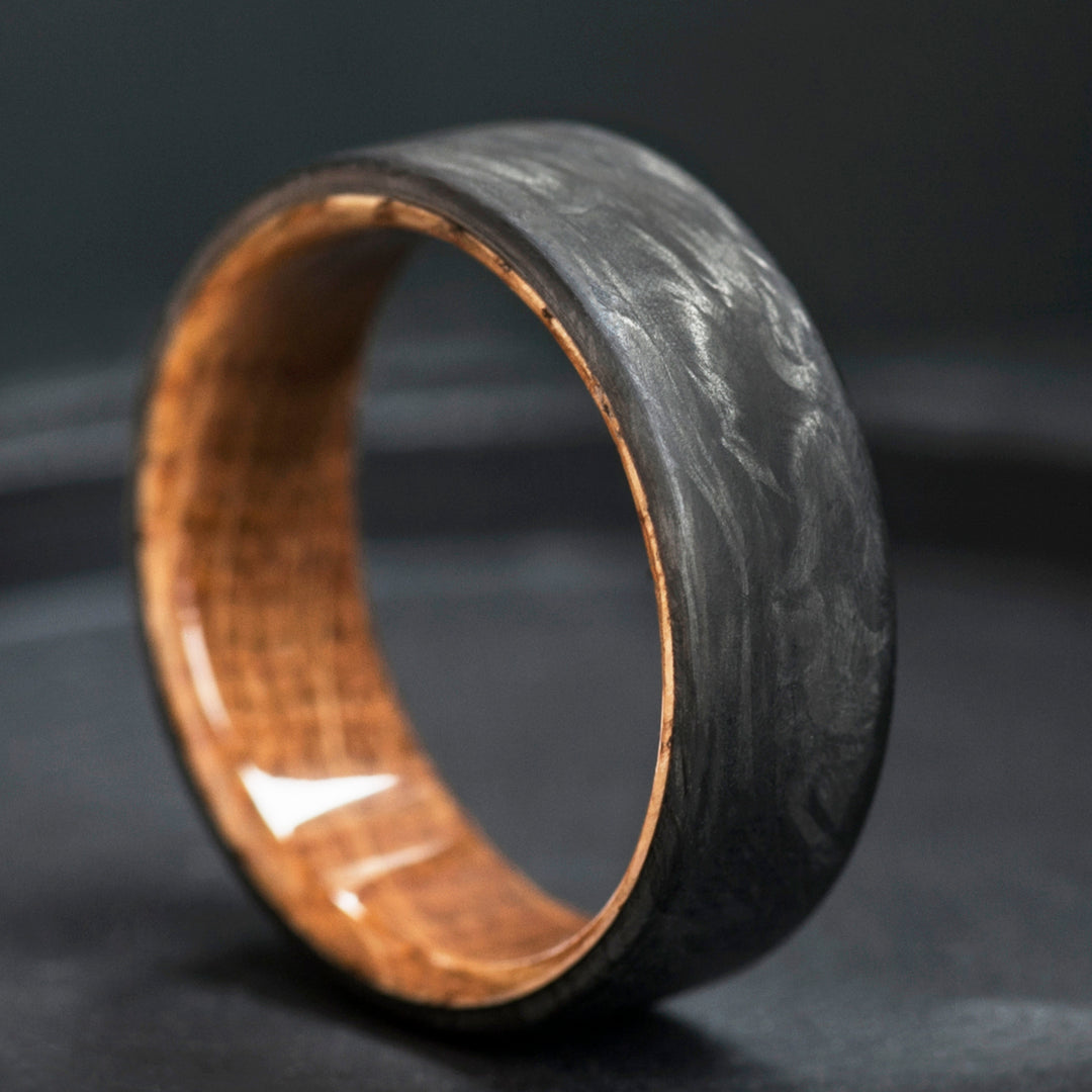 Whiskey barrel oak wood interior detail - carbon fiber wedding band - amber wood grain
