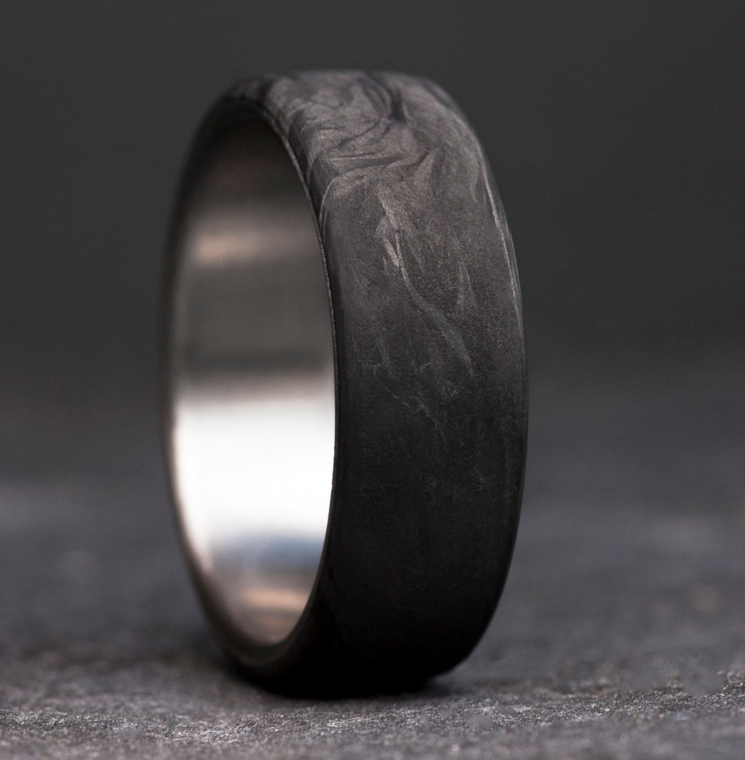 Mens titanium forged carbon fiber wedding band - marbled black surface - handcrafted ring