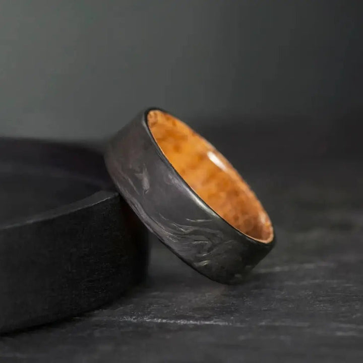 Man wearing handcrafted whiskey barrel carbon fiber wedding ring